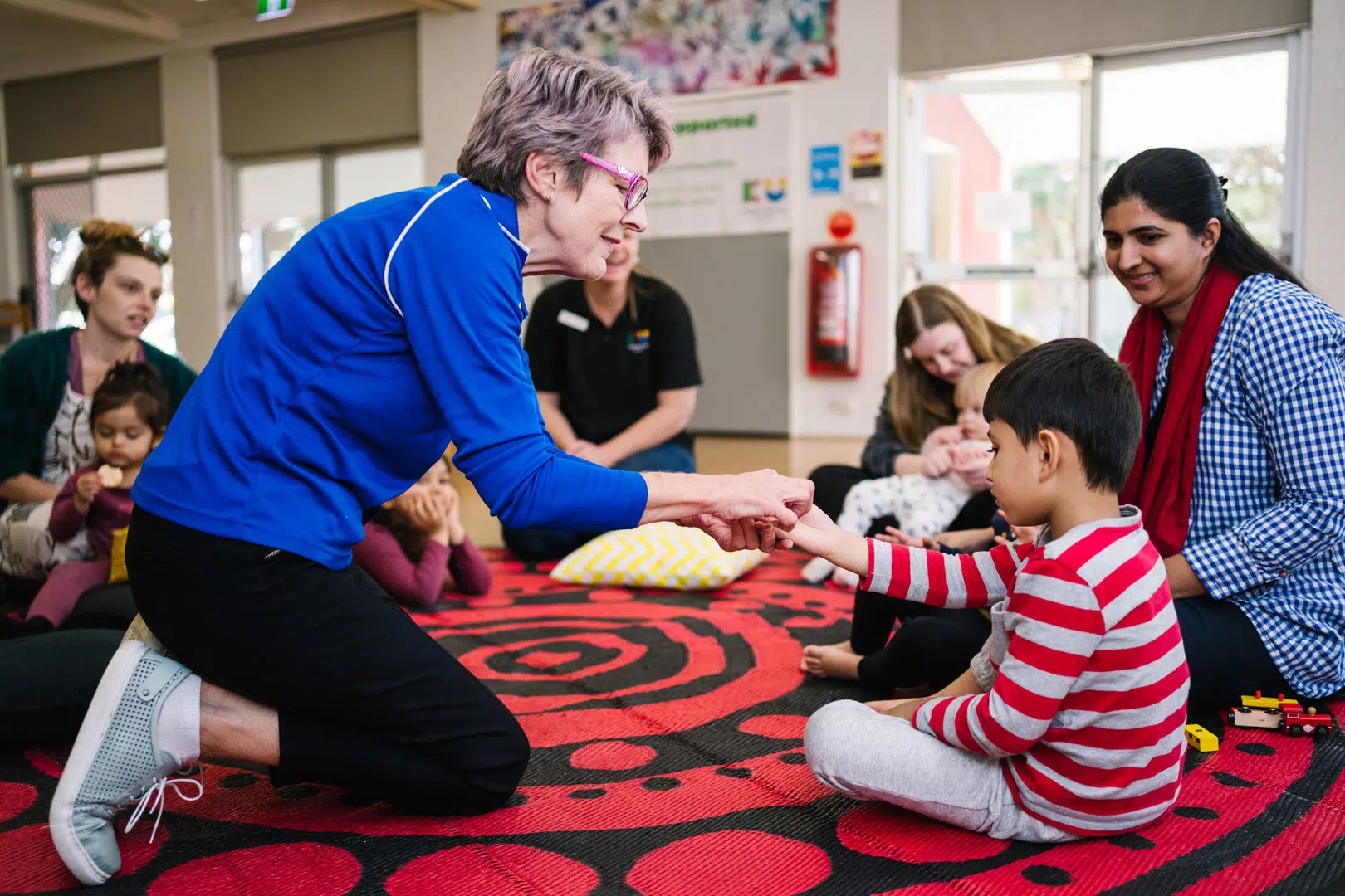 KU NSP Shortland Public School childcare educators interacting with children