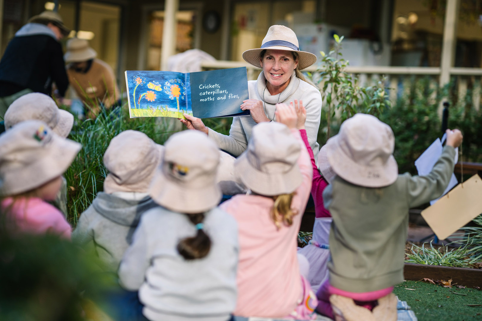 Educator reading to children at South Turramurra childcare