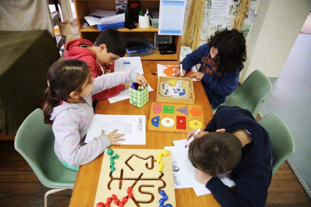 Children colouring in at KU John J. Carroll childcare