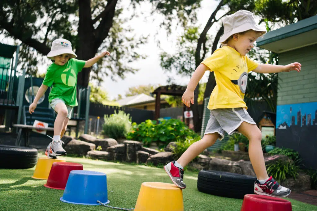 Children on stepping stones at KU Sutherland childcare