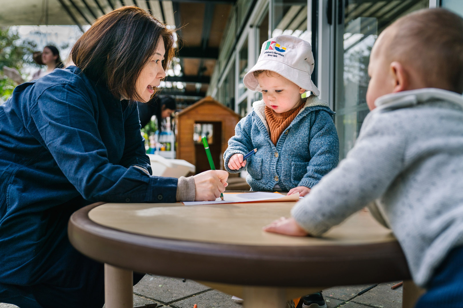Teacher interacting with children at Sydney CBD childcare