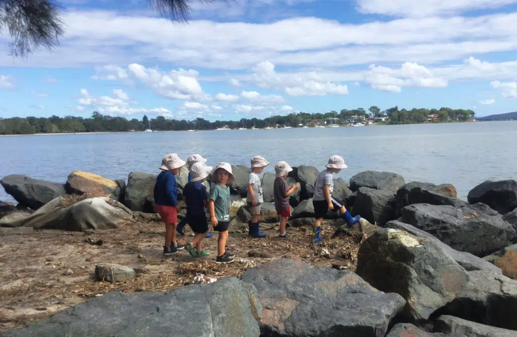 Children playing outdoors at KU Peninsula childcare