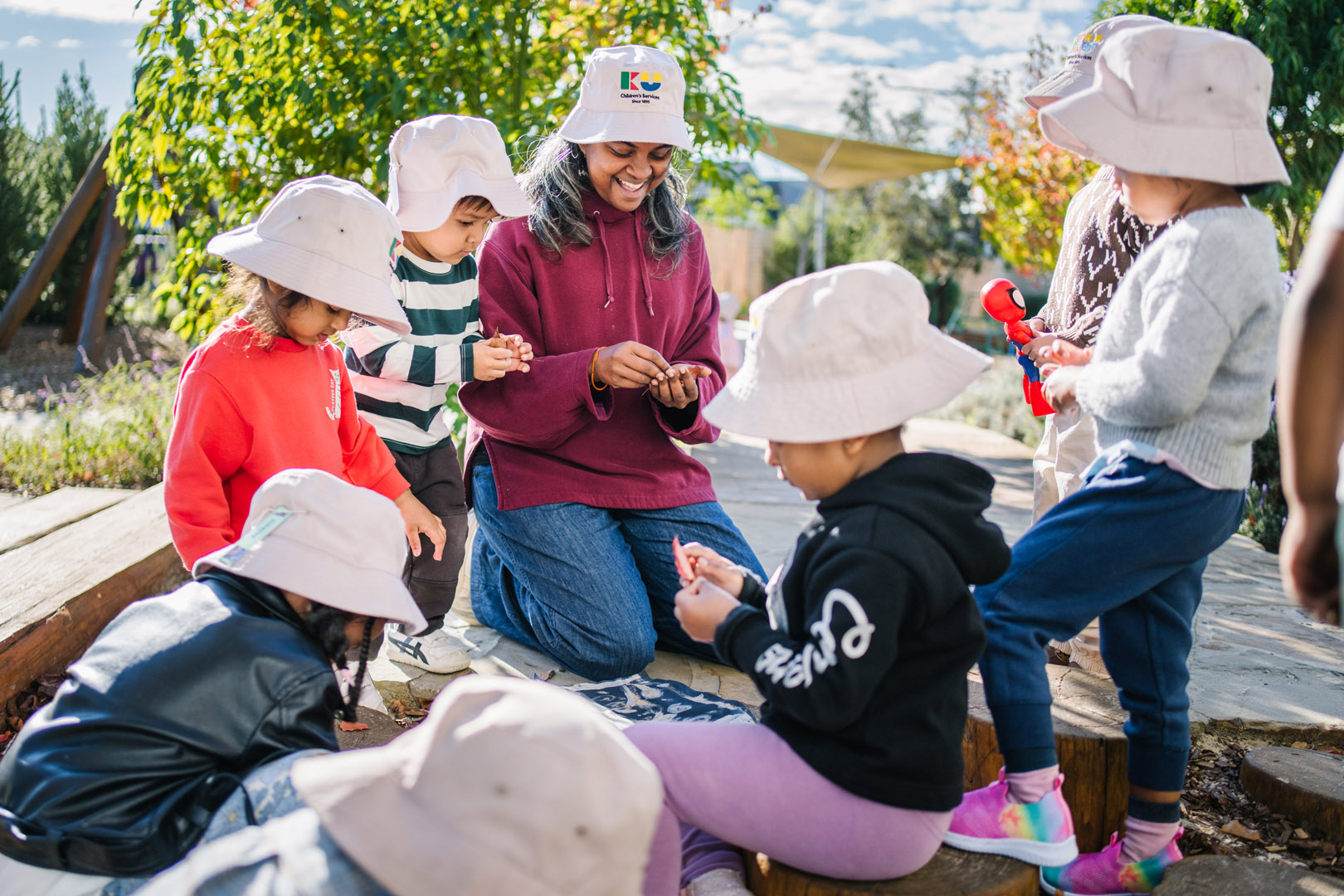 Child and educator engaged in outdoor play at Dianella Kindergarten in Tarneit