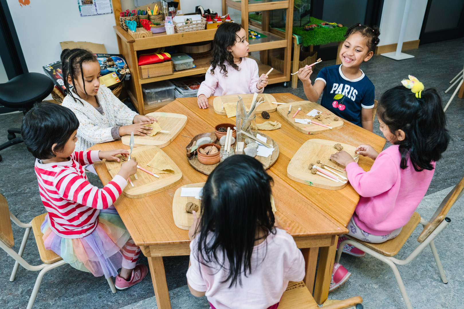 Children engaged in clay work at Dianella Kinder in Tarneit