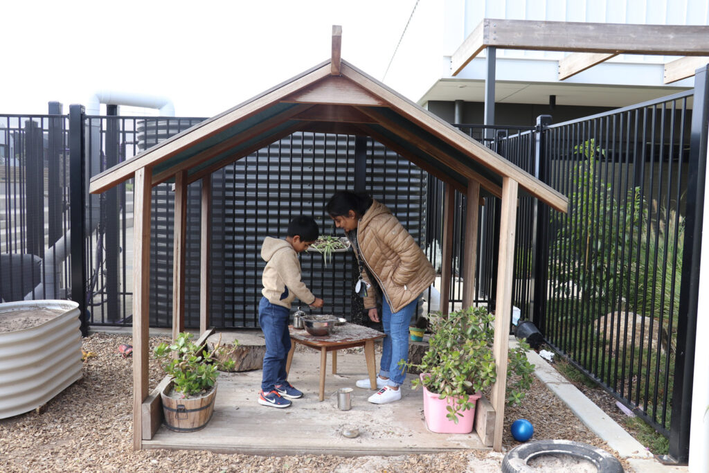 KU Dianella childcare educator interacting with a child
