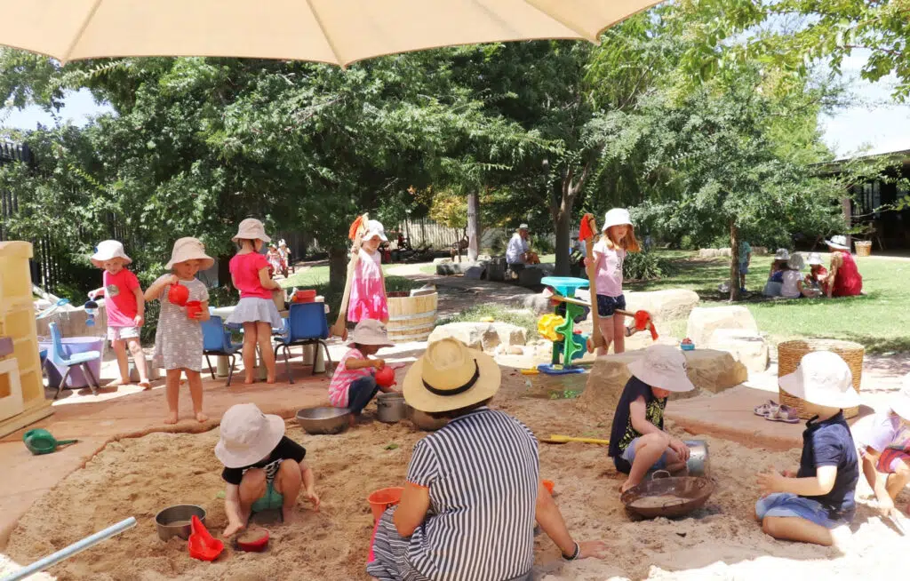 Children playing outdoors at KU Koala childcare