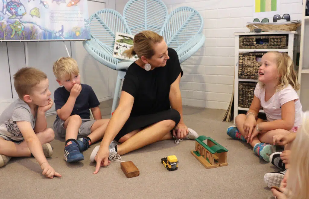 KU Kangaroo childcare educator interacting with children