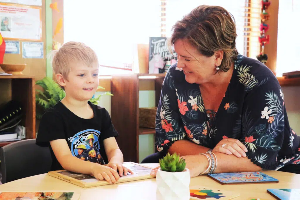 KU Kingfisher childcare educator interacting with a child
