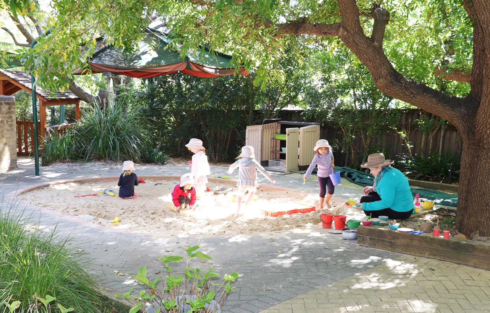 Children playing outdoors at KU Wahroonga childcare