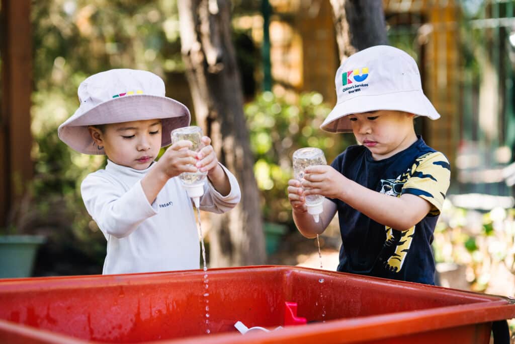 Children playing with water at KU Mariemont childcare in Wantirna