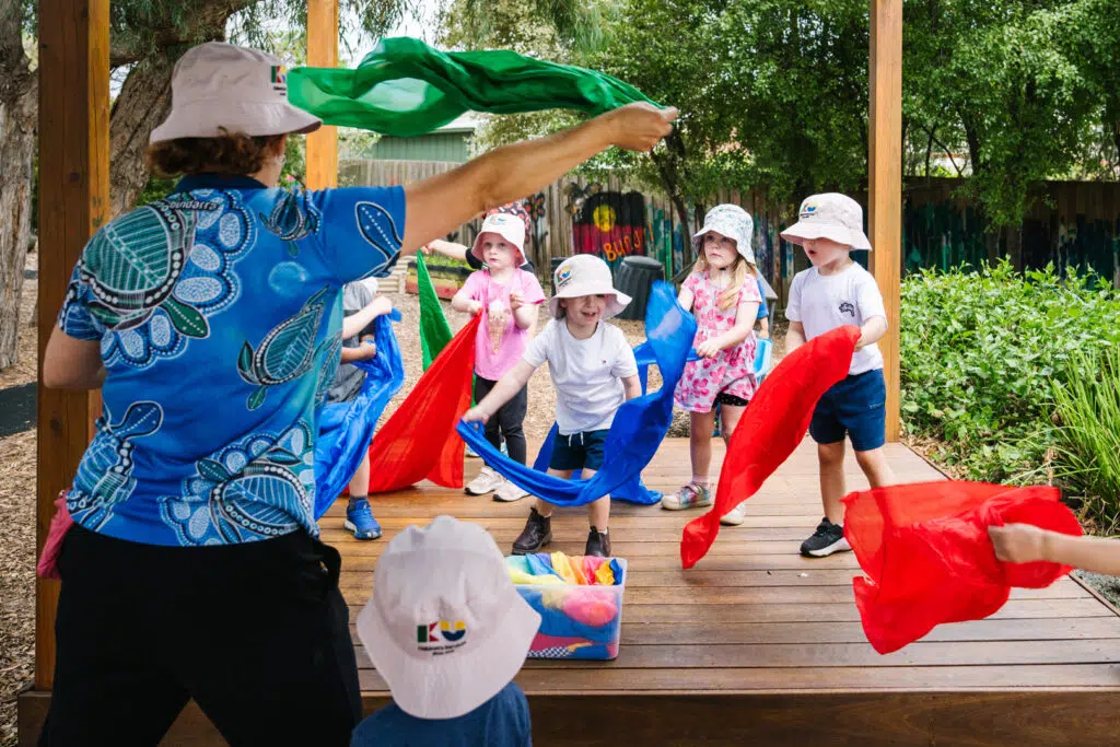 Educator dancing with children at KU Riddell Road Childcare in Wantirna South