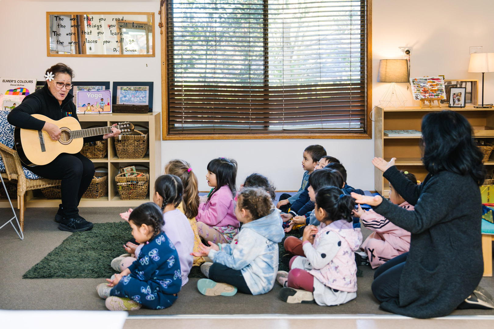 Educator singing with children at West Lindfield Childcare