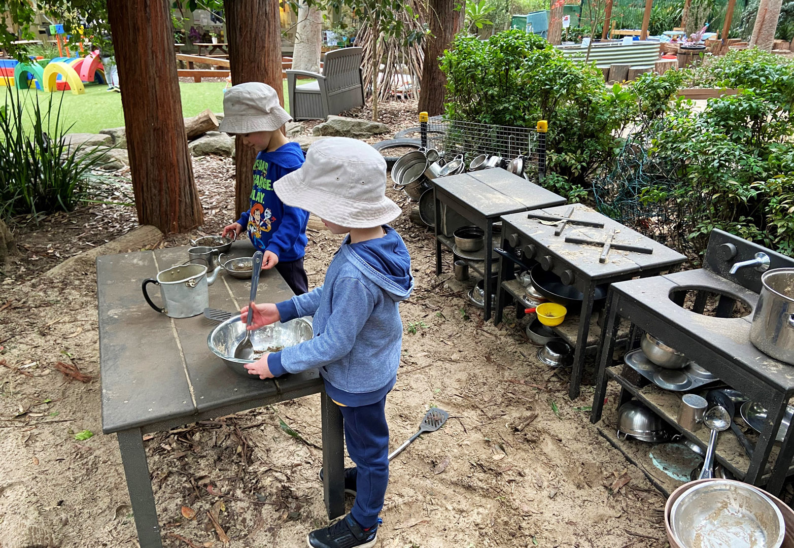 Children using the outdoor kitchen at KU West Pymble childcare