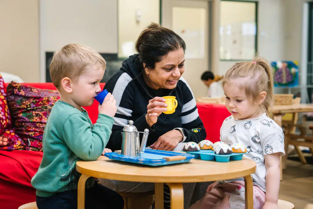 KU Concord childcare educator playing with children