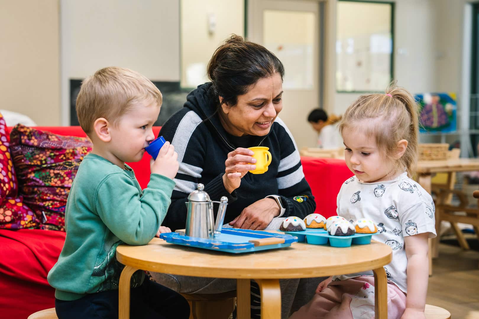 KU Concord childcare educator playing with children