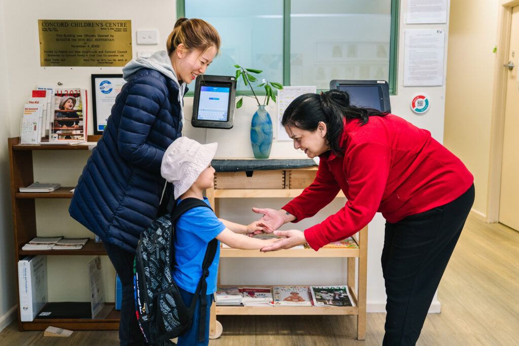 KU Concord childcare educator greeting child