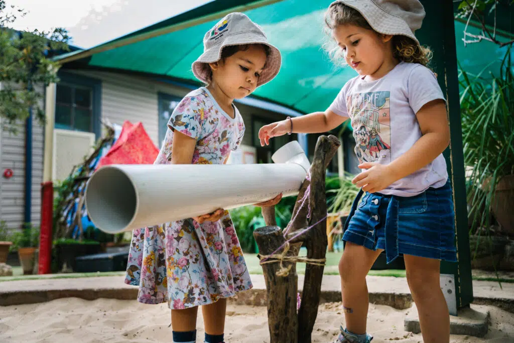 Children playing outdoors at KU Carillon childcare