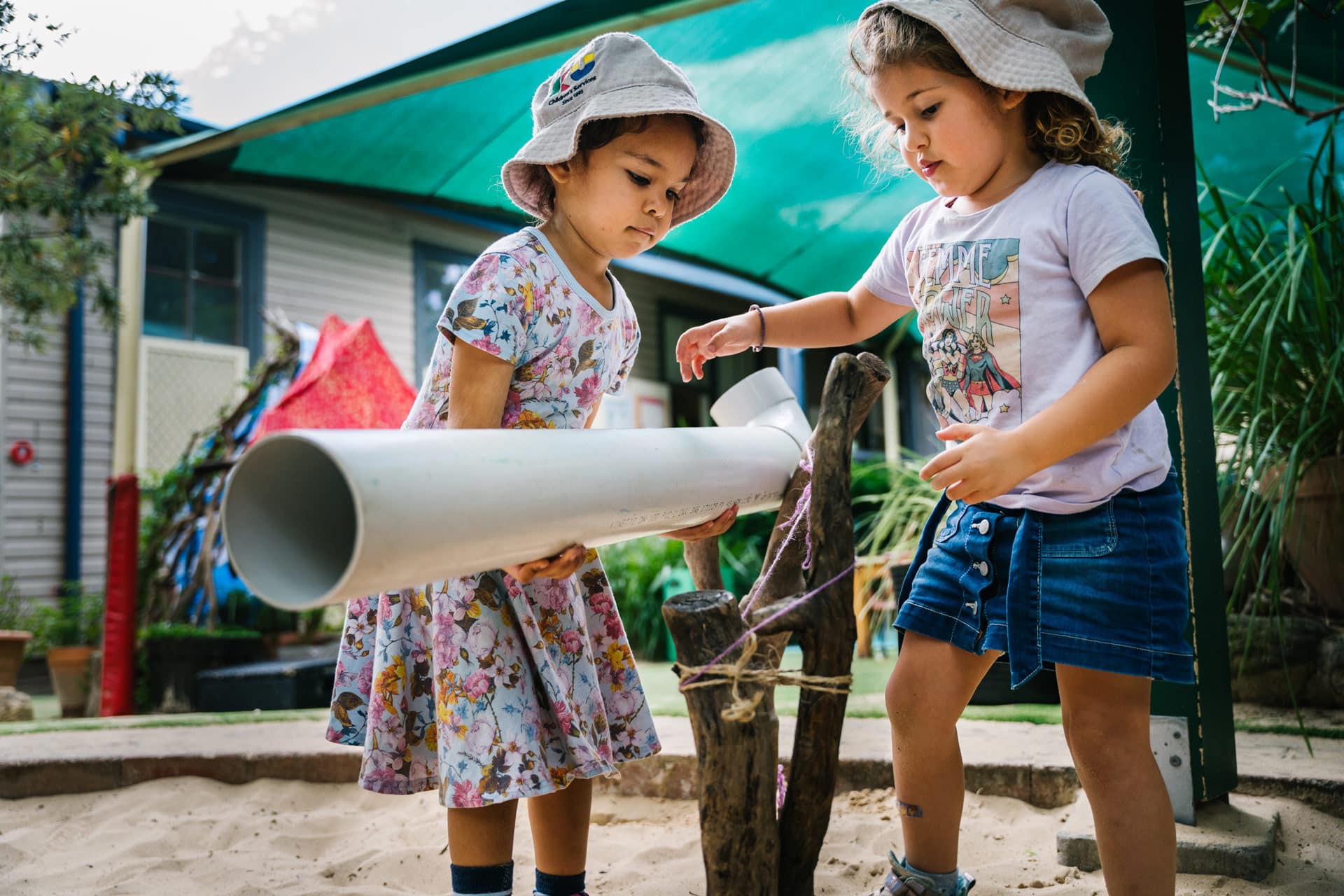 Children playing outdoors at KU Carillon childcare
