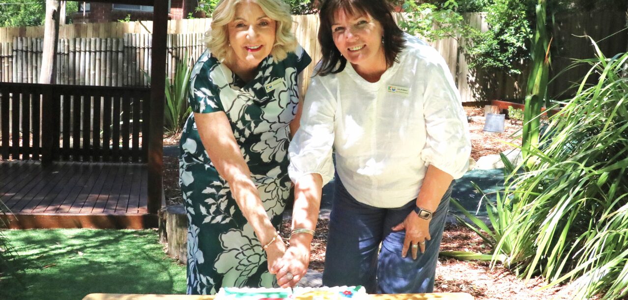 Chris Legg and ECT Julie cutting KU Chatswood West Preschool 70th Anniversary Cake